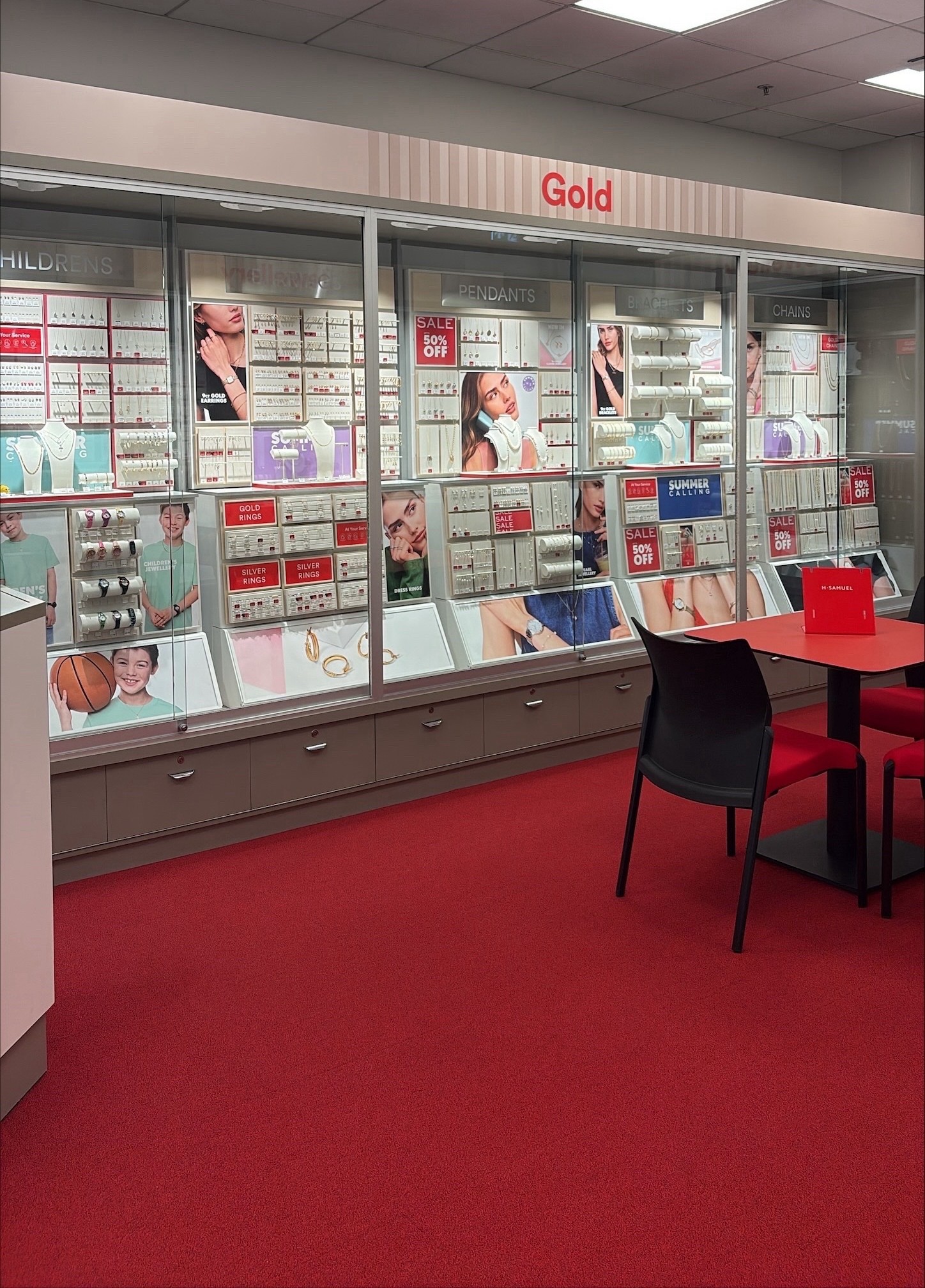 Gold jewellery display and consultation seating inside H Samuel’s Telford store